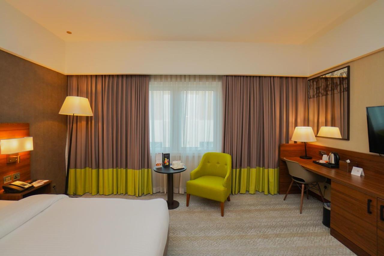 The Grand Lux Hotel Doha Dış mekan fotoğraf A room at the hotel