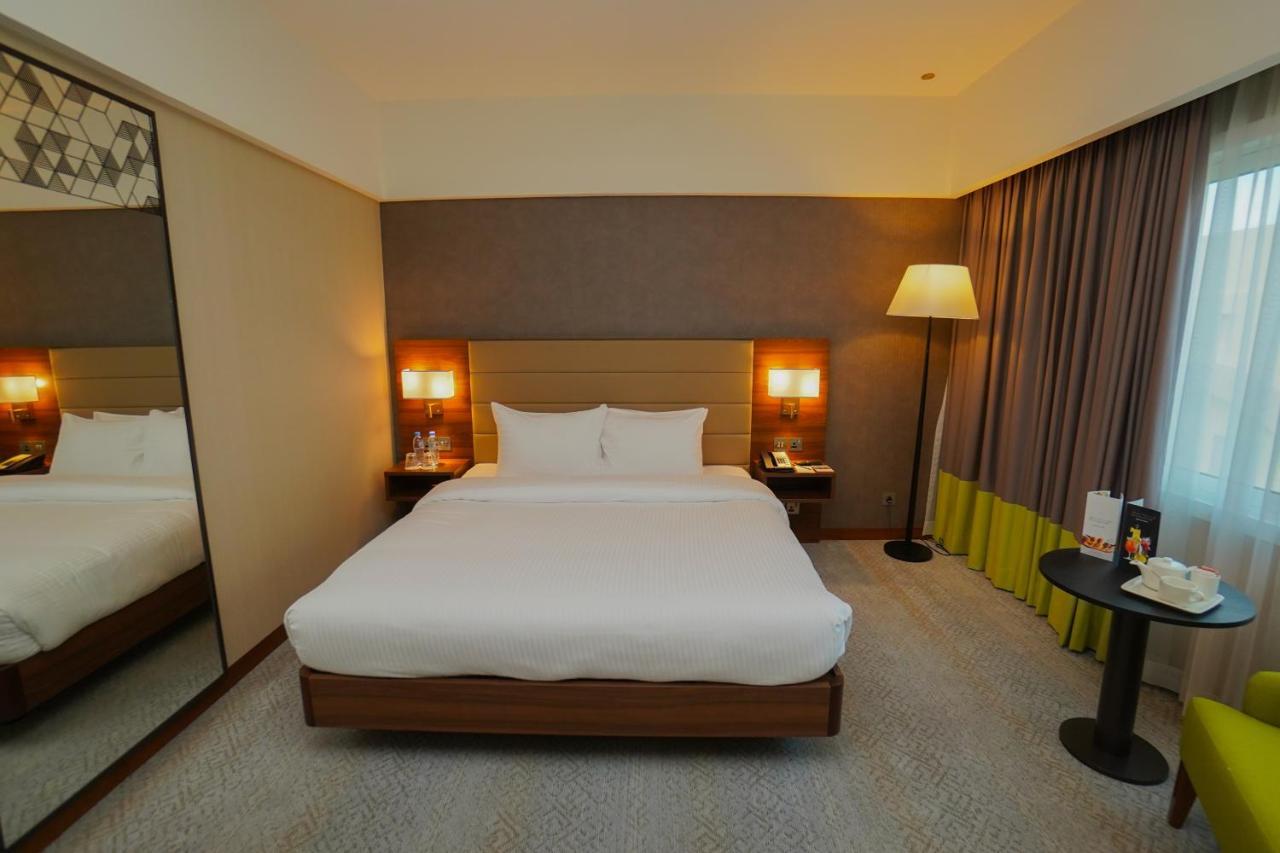 The Grand Lux Hotel Doha Dış mekan fotoğraf A room at the hotel