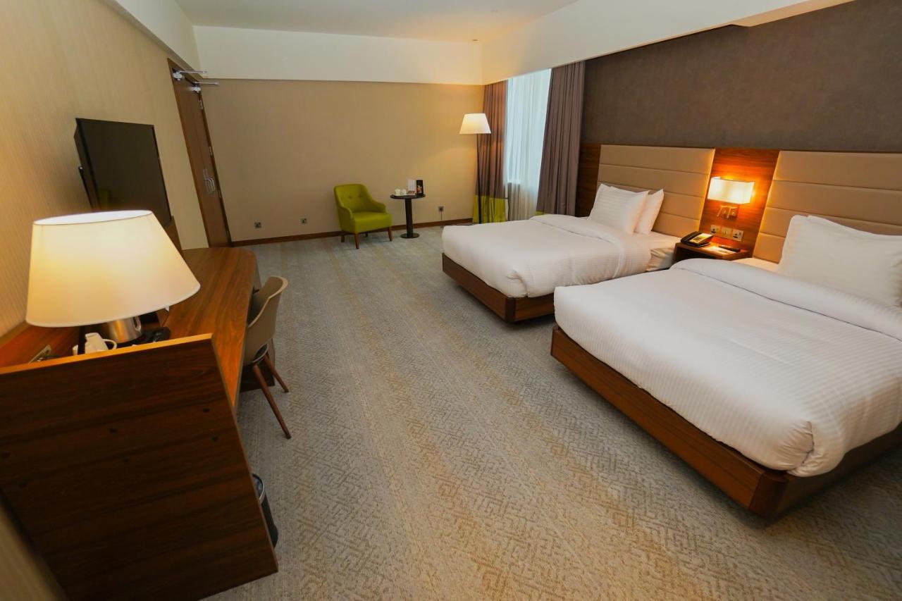 The Grand Lux Hotel Doha Dış mekan fotoğraf A room at the hotel